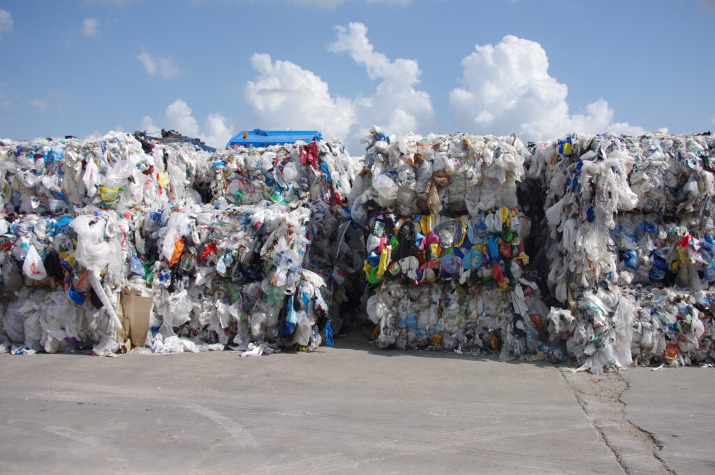 Bales of ridged and film plastics consolidated and prepared to be shipped for processing into post consumer recycled resin WMRR Plastics Recycling